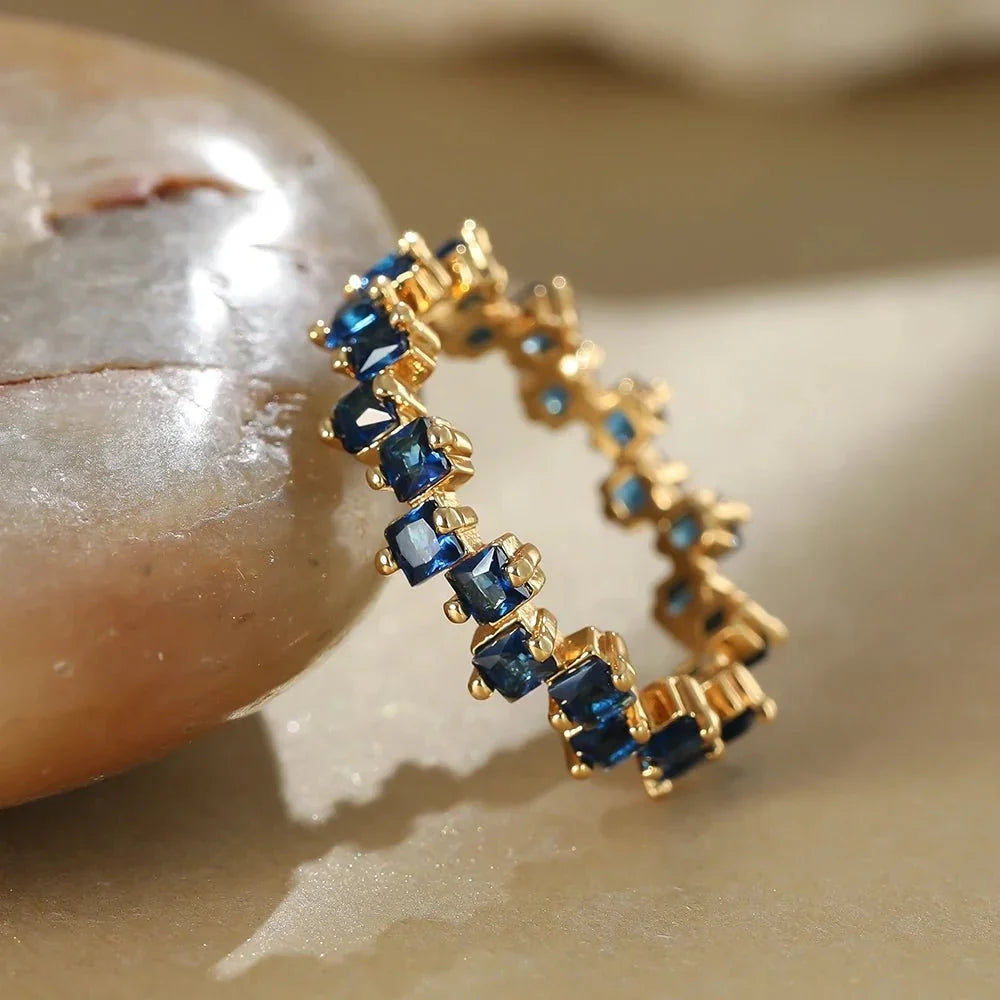 Women's Ring with Scattered Square Stone Accents and Offset Design