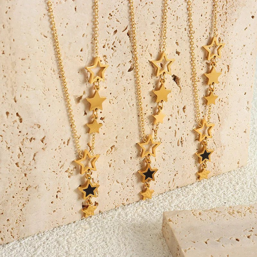 Women's Star Necklace with Multiple Charms and Asymmetrical Star Design